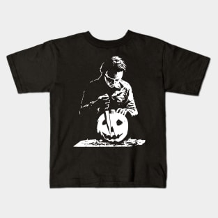Michael carving a halloween pumpkin Kids T-Shirt